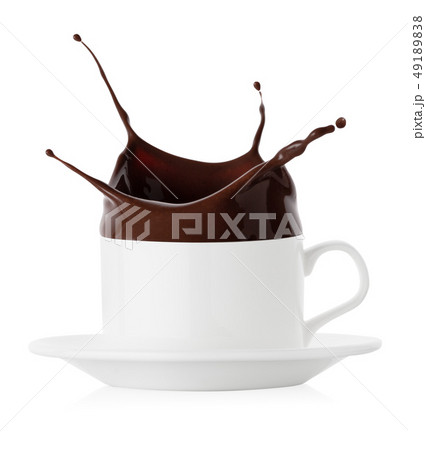 Splash of black chocolate in white cup and saucer Splash of black chocolate in white cup and saucer 49189838
