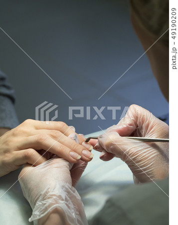 Procedure of processing the cuticle in manicure. Procedure of processing the cuticle in manicure. 49190209