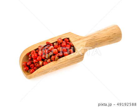 pink peppercorn in wood scoop isolated on white 49192588