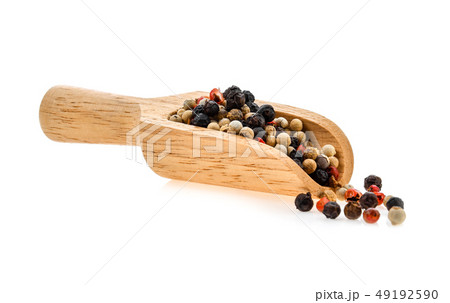 dried peppers in wood scoop isolated on white dried peppers in wood scoop isolated on white 49192590