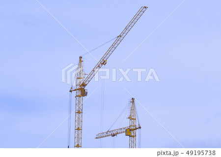 construction cranes construction of houses construction cranes construction of houses 49195738