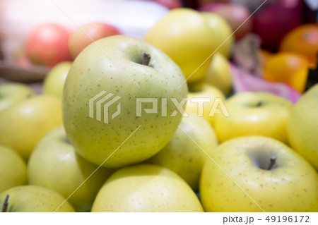 Green apple pile on shelf at supermarket Green apple pile on shelf at supermarket 49196172