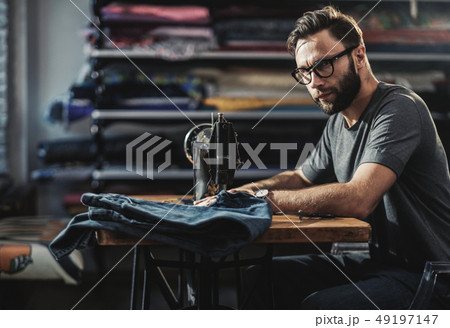 Fashion designer working in his studio 49197147