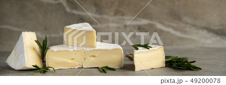 Cheese camembert or brie with fresh rosemary 49200078