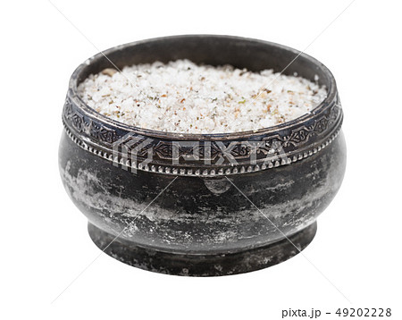 side view of silver salt cellar with seasoned salt 49202228