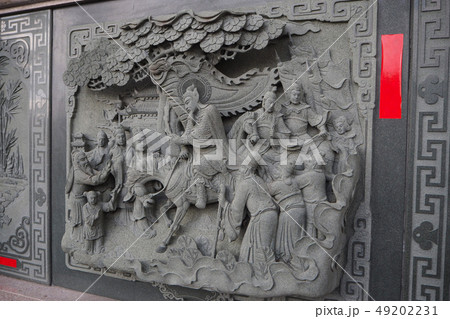 Decorative stone carving on the wall at Sun Moon 49202231