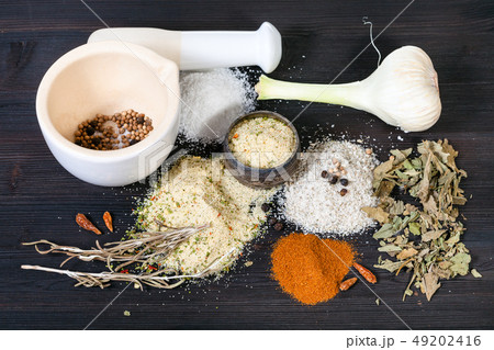 various Seasoned Salts with ingredients on table 49202416