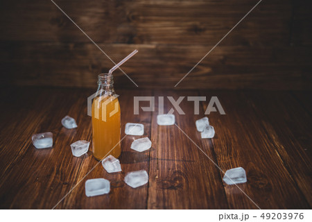 Ice fresh juice with ice cubes on table 49203976