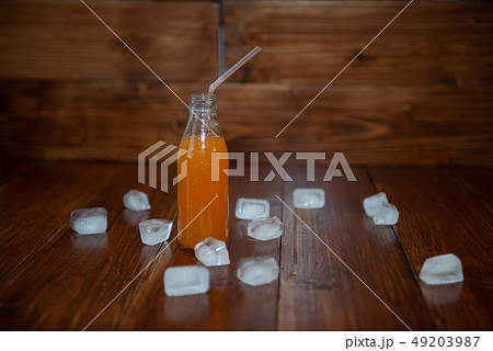 Ice fresh juice with ice cubes on table Ice fresh juice with ice cubes on table 49203987