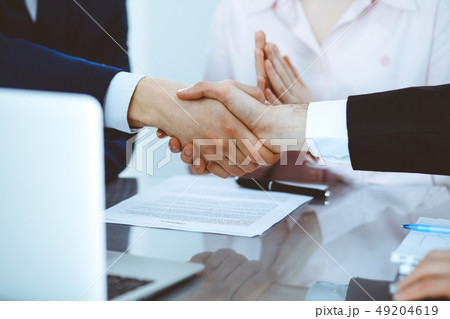 Business people shaking hands finishing up a meeting. Handshake at successful negotiation 49204619