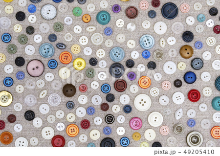 background - multicolored buttons on the fabric 49205410