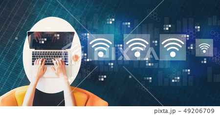 Wifi concept with person using a laptop Wifi concept with person using a laptop 49206709