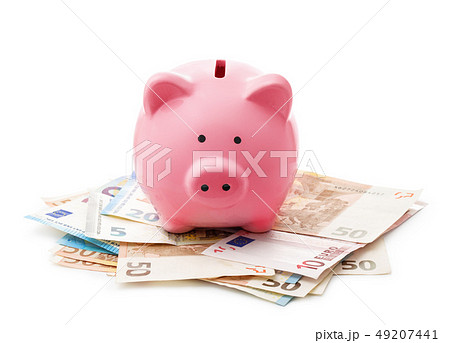 Pink piggy bank on euro banknotes Pink piggy bank on euro banknotes 49207441