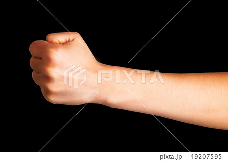 Woman clenched fist. Concept of unity, fight or cooperation Woman clenched fist. Concept of unity, fight or cooperation 49207595