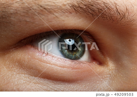 Male right green eye extreme closeup 49209503