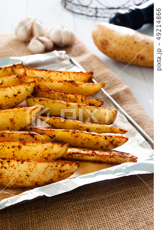 Baked potato wedges on tray - homemade organic 49214866