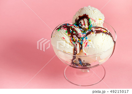 scoops of white ice cream in glass bowl decorated scoops of white ice cream in glass bowl decorated 49215017