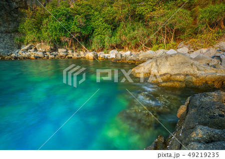 he Smooth sea wave with rocky beach at Phuket. 49219235