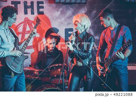 Band playing on stage making music 49221088