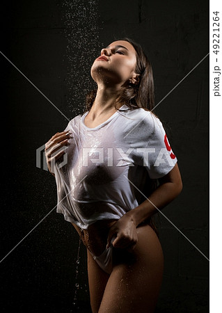 Young brunette in sexy top in shower view 49221264