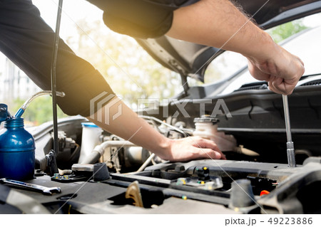 checking vehicle engine at the garage industrial checking vehicle engine at the garage industrial 49223886