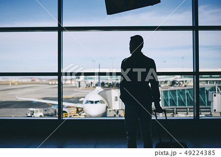 Traveler in airport terminal Traveler in airport terminal 49224385