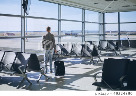 Traveler in airport terminal Traveler in airport terminal 49224390