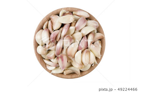 garlic cloves in wooden bowl isolated on white 49224466
