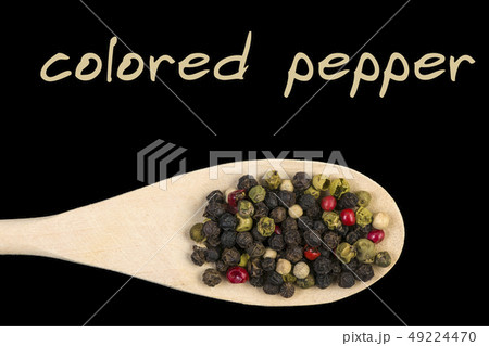 colored pepper on wooden spoon isolated 49224470