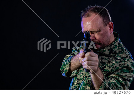 Soldier holding assault rifle 49227670