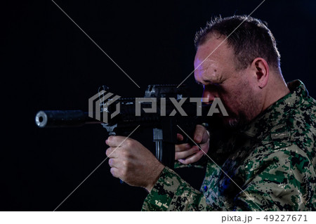Soldier holding assault rifle 49227671