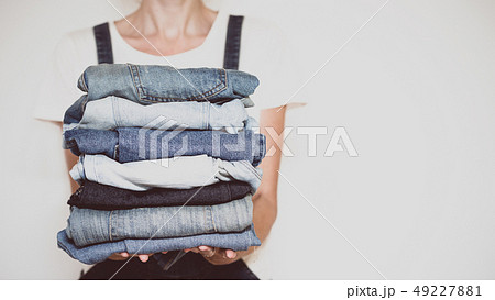 jeans in her hands jeans in her hands 49227881