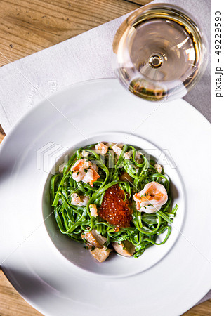 Pasta with shrimp and salmon caviar. Pasta with shrimp and salmon caviar. 49229590
