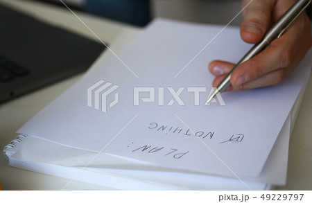 Male hand hold silver pen composing to do list Male hand hold silver pen composing to do list 49229797
