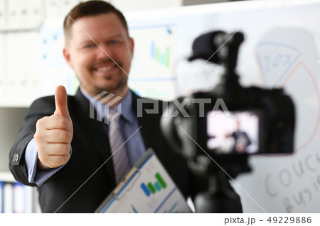 Male in suit and tie show confirm sign Male in suit and tie show confirm sign 49229886