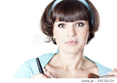 Attractive brunet woman in blue dress with two Attractive brunet woman in blue dress with two 49230134