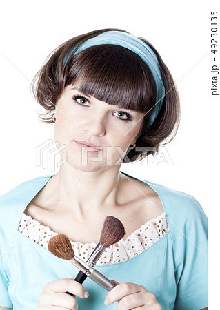 Pretty woman in blue dress with two make-up 49230135
