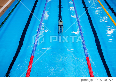 Muscular man under water in a swimming pool 49230157