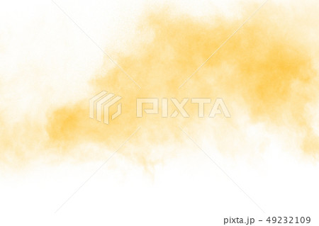 Yellow color powder splatter on white background. Yellow color powder splatter on white background. 49232109