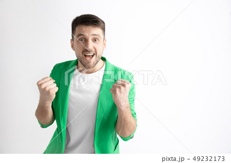 Winning success man happy ecstatic celebrating being a winner. Dynamic energetic image of male model 49232173