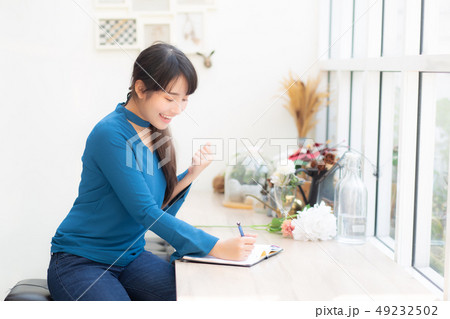Beautiful portrait asian woman writer excited 49232502