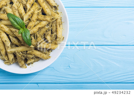 Italian penne pasta with sauce pesto Italian penne pasta with sauce pesto 49234232