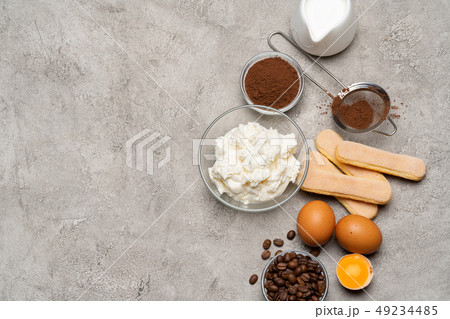 Ingredients for cooking tiramisu - Savoiardi biscuit cookies, mascarpone, cheese, sugar, cocoa Ingredients for cooking tiramisu - Savoiardi biscuit cookies, mascarpone, cheese, sugar, cocoa 49234485