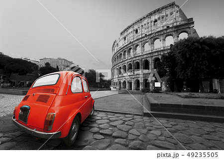 Old car in the background of the Colosseum in Rome 49235505