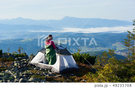 Camping on the top of mountain on bright summer morning 49235708