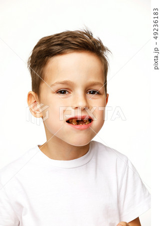 little beautiful boy holding chocolate studio shot  49236183