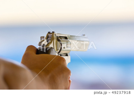 Man hold a gun ready to shoot practicing  49237918