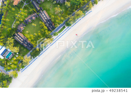 Aerial view of sandy beach with tourists swimming Aerial view of sandy beach with tourists swimming 49238541