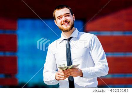 young businessman with cash money  49239195