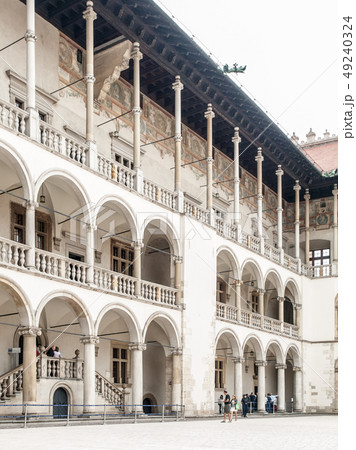 Courtyard with white arcades of Wawel Castle, Krakow, Poland 49240324